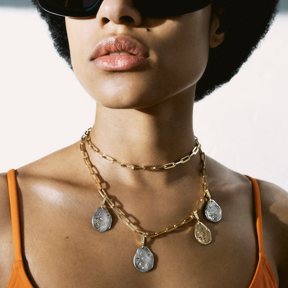 Médaille or gris Mellerio